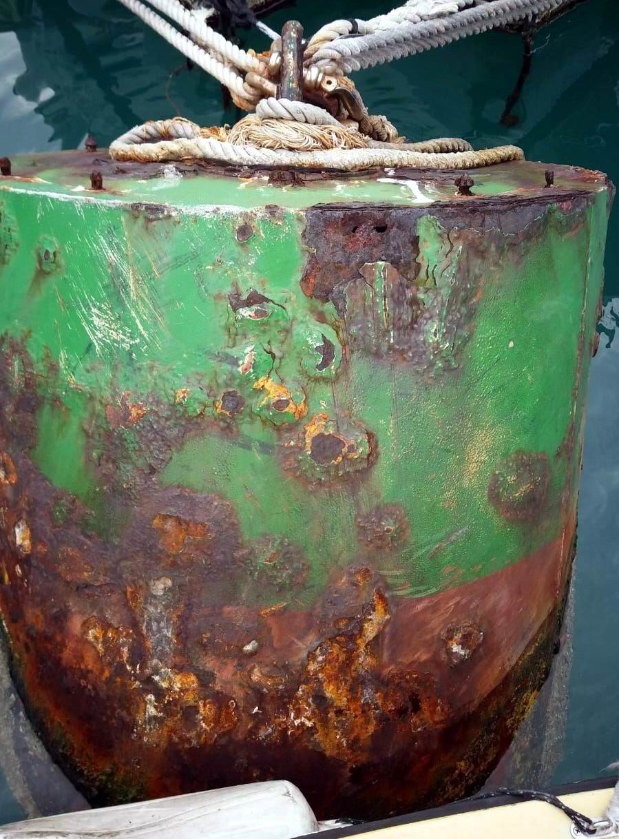 Rusty and Holed Steel Buoy